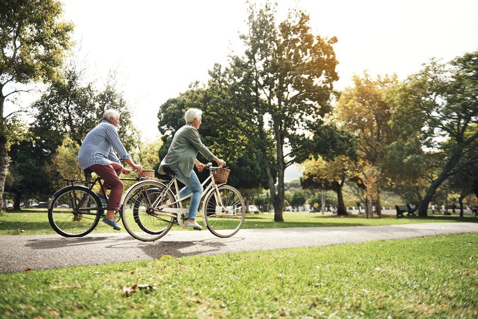 Couple biking on paved path
