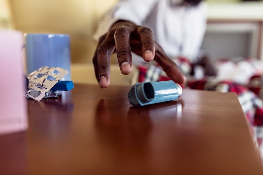 Ill Mature Afro-American is Using Asthma Inhaler