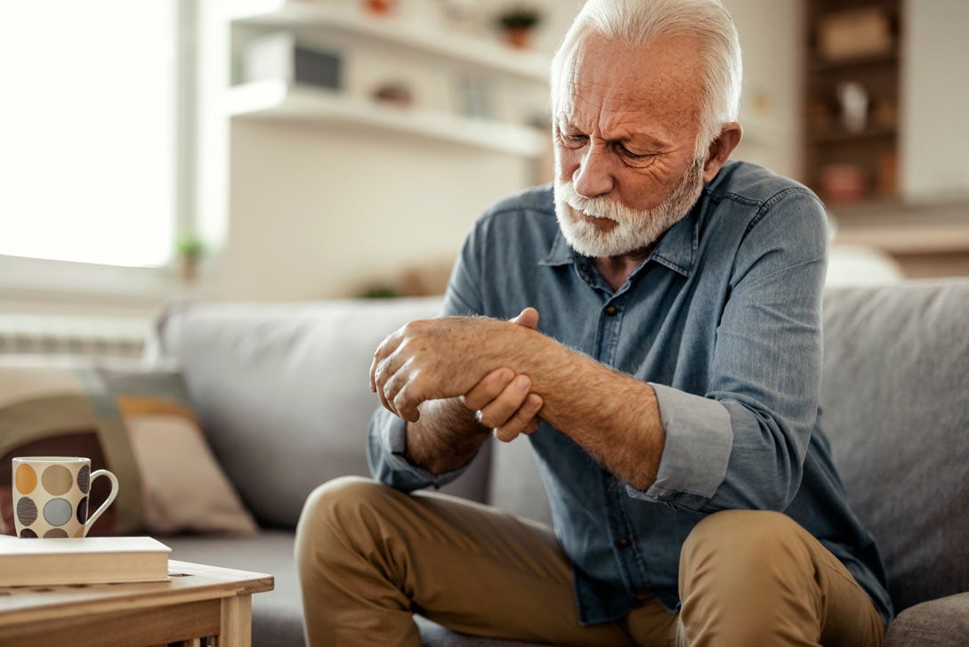 Elderly male patient suffer from numbing pain in hand