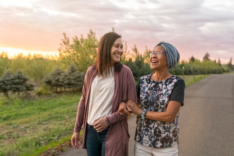 Daughter and mother walking and enjoying time together